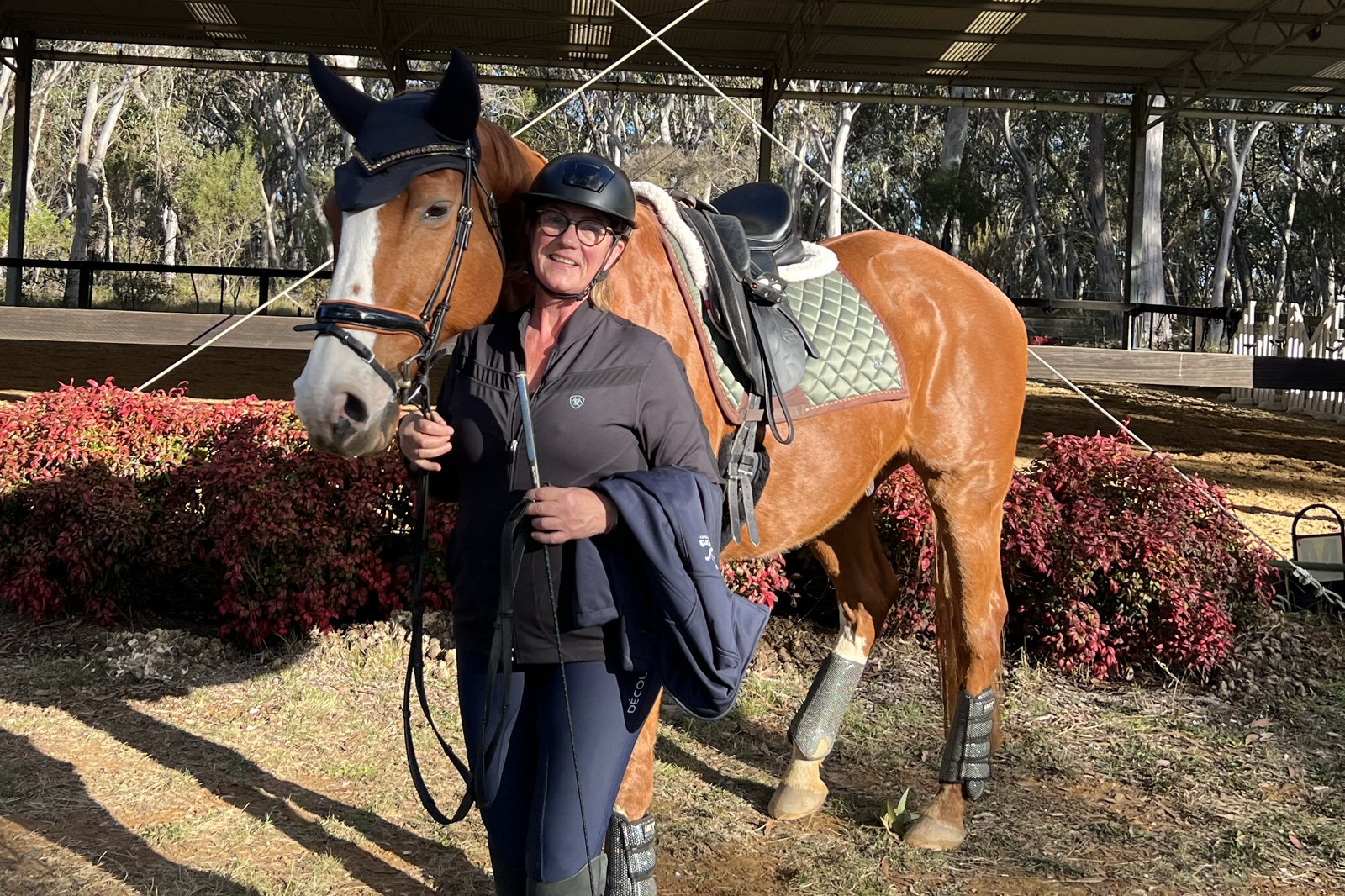 Alison with her horse Darcy at the covered arena